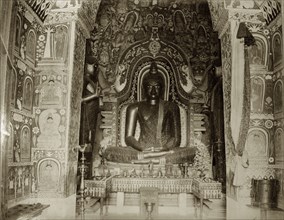 Statue of Budda. Interior of a Buddhist temple and associated Budda statue. Ceylon (Sri Lanka),