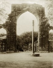 The Iron Pillar at Qutb, circa 1885. The Iron Pillar stands before the ruins of Quwwat-ul-Islam