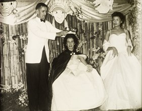Wallace Macmillan crowns a Carnival Queen. Wallace Macmillan (1913-1992), the British colonial