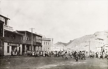 Rioting in Aden, 1947. Crowds of people fill a street in Aden during Arab riots that took place in