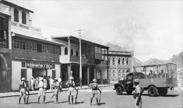 Armed police during the Arab riots in Aden, 1947. Armed police climb out of an armoured vehicle and