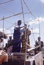 Kenneth Kaunda at United National Independence Party rally. Kenneth Kaunda (born 1924) steps up to
