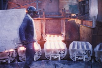 Moulding copper, Nkana-Kitwe. A smith oversees the pouring of refined copper from a furnace into