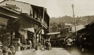 Bazaar at Mussoorie, India. Ramshackle buildings line a winding road at a bazaar in Mussoorie. A