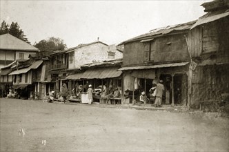 Street traders at a bazaar, India. Street traders at a bazaar sell their wares from ramshackle