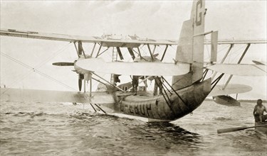 Flying boat, Nigeria. The flying boat 'Singapore', piloted by Sir Alan Cobham, is secured to a buoy