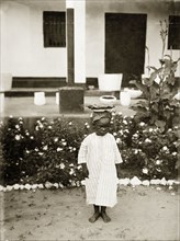Young boy, Nigeria. A young African boy, identified as 'Bobby', is pictured in the garden of a