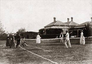 Mixed-doubles tennis match. A mixed-doubles tennis match on a grass court at 'Nundora', the house