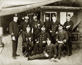 Officers of the RIMS 'Minto'. Group portrait of ten uniformed officers posed on the deck of the