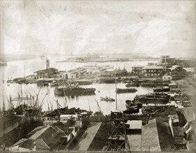 Entrance to the Suez Canal at Port Said. Vessels moored at a Port Said harbour at the entrance to