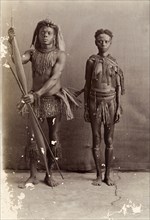 Couple from the Andaman Islands. A man and a woman from the Andaman Islands stand, facing the
