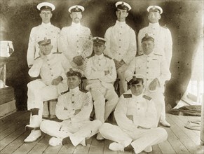 Officers aboard RIMS 'Investigator'. Group portrait of nine uniformed officers posed on the deck of