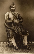 Maharajah of Datia. Studio portrait of the Maharajah of Datia, dressed in his robes for the