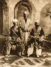 Chiefs dressed for the Coronation Durbar. Group studio portrait featuring Raja Sikander Khan of