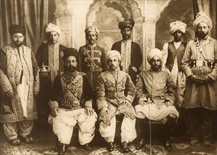Pakistan chiefs dressed for the Coronation Durbar. Group studio portrait featuring the Khan of Dir,