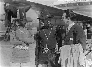 John Bentley with customs officials. Hollywood film star John Bentley chats to two uniformed