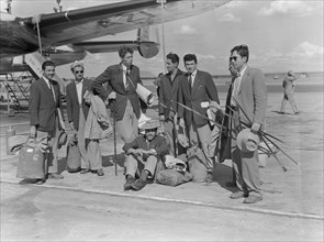 Arrival of a French athletics team. Members of a French athletics team wait on the runway with