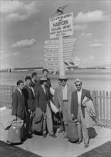 French athletics team. Members of a French athletics team pose beneath a signpost on their arrival