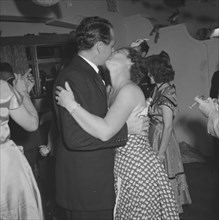 Kissing couple, Kenya. Mrs Archer and Eric Cecil are captured mid-embrace on the dancefloor at a
