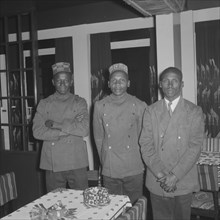 Waiters at the Equator Club. Portrait of three uniformed African waiters at the Equator Club.