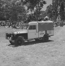 Road Service jeep. A jeep labelled 'Road Service' makes an appearance in a vehicle parade being
