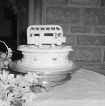 Double-decker cake. A novelty wedding cake, decorated with a miniature double-decker bus for Peter