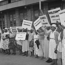 Female Kenyan demonstrators. Kenyan women involved in a peaceful demonstration at an airport, hold