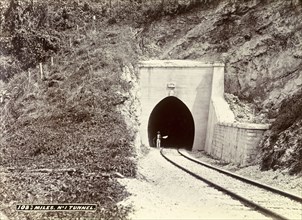 Railway tunnel 'No. 1', Jamaica. A man stands at the entrance to a newly constructed railway tunnel