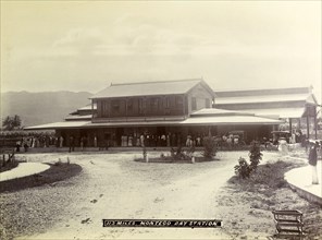 Montego Bay railway station. A crowd of passengers waits on the veranda outside Montego Bay station