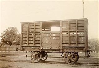 Jamaica Railway wagon. A railway wagon inscribed 'J. R. No.115', sits on rails at a siding.