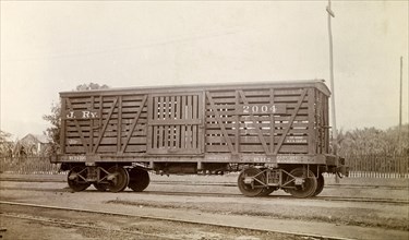 Jamaica Railway wagon. A closed railway wagon inscribed 'J. RY.2004', sits on rails at a siding.