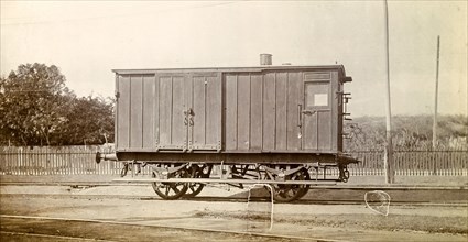 Jamaica Railway wagon. A closed railway wagon sits on rails at a siding. Jamaica, circa 1895.