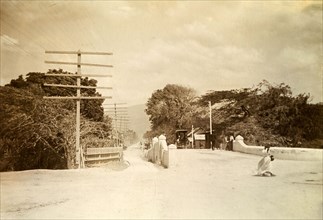 Kingston tram lines. Rails laid down for mule-drawn trams criss-cross a road bridge flanked by