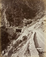 Darjeeling Hill Railway. A small bridge carries a section of the Darjeeling Hill Railway across a