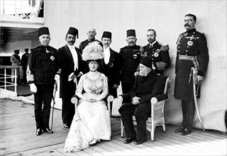 Dignitaries aboard HMS Medina. King George V (r.1910-36) and Queen Mary with Kiamil Pasha, Lord