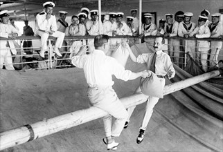 Pillow fight aboard HMS Medina. Major Lord Charles Fitzmaurice (left), Equerry to King George V,