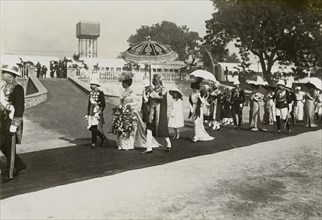 King George V in Delhi. King George V (r.1910-36) and Queen Mary proceed along a red carpet laid