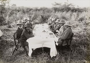 Royal lunch in the jungle. King George V (r.1910-36), seated front left, takes lunch with his