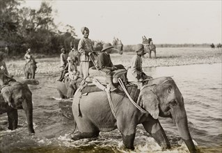 King George V crosses a river. King George V (r.1910-36) crosses a river on the back of an elephant