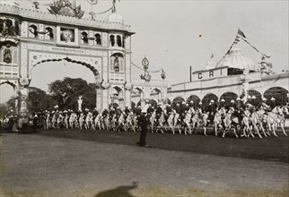 Hussar escort at Calcutta. A uniformed regiment of Hussars provide a mounted escort for King George