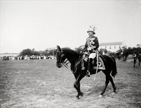 The Duke of Connaught reviews troops. The Duke of Connaught, dressed in full military regalia,
