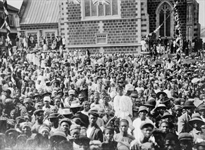 Crowd for the Duke of Connaught. A large crowd of African civillians gather outside a church in