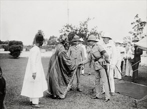 Duke of Connaught meets an African chief. The Duke of Connaught shakes hands with an African chief