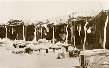 Market stalls, Khartoum. Street traders sell cooking utensils and household goods from the shade of