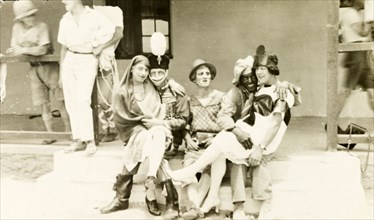 Soldiers in fancy dress. A group of British soldiers pose, wearing a variety of fancy dress