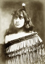 Young Maori woman. Studio portrait of a young Maori woman whose traditional dress has been made