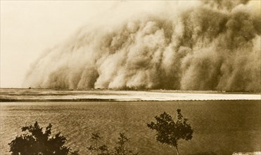 Sandstorm at Khartoum. A huge cloud of sand sweeps over the River Nile, north of Khartoum, during a
