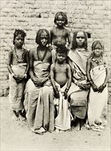 Bisharin women and children. Portrait of two Bisharin women and their four children. Their hair is