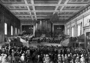 Anti-slavery meeting. A crowd of anti-slavery campaigners pack out a large hall to air their