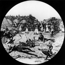 Slave raid in an African village. African warriors attempt to defend their village from a raid by